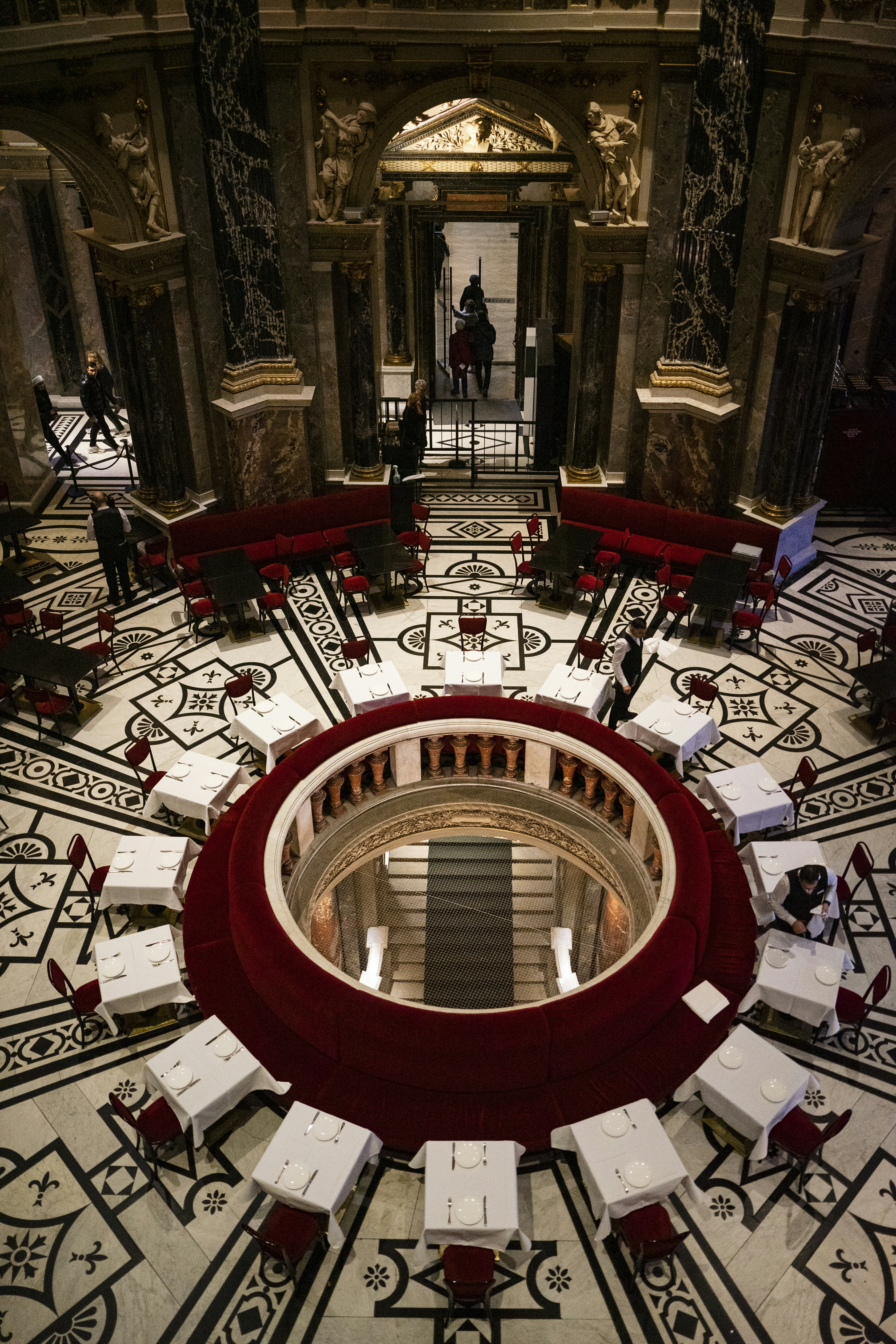 a circular room with tables and chairs in it