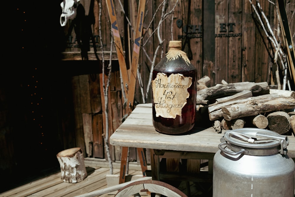 a bottle of wine sitting on top of a wooden table