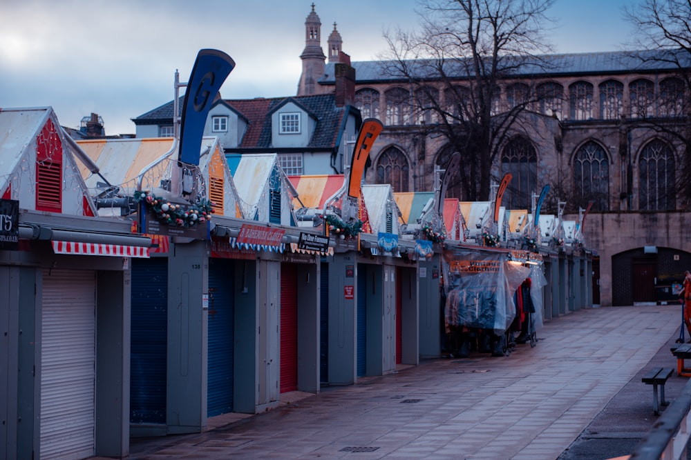 a row of closed shops on a city street