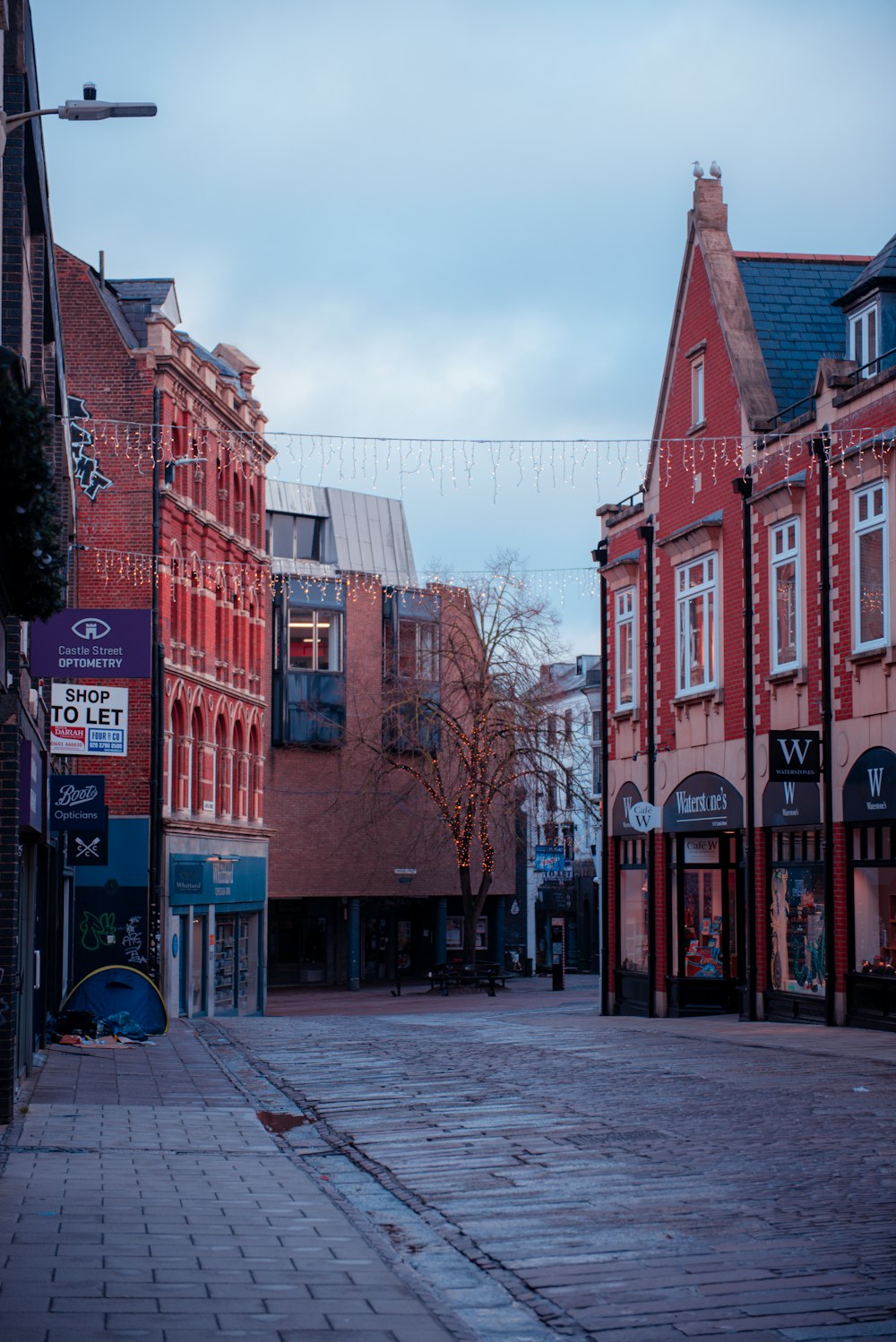 a city street with a few buildings on both sides of it