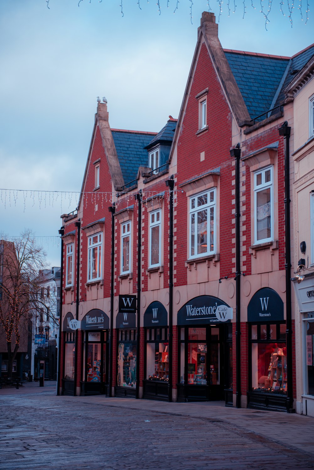 a row of red brick buildings sitting next to each other