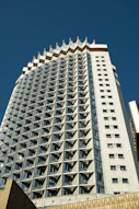 a very tall building with many windows on top of it