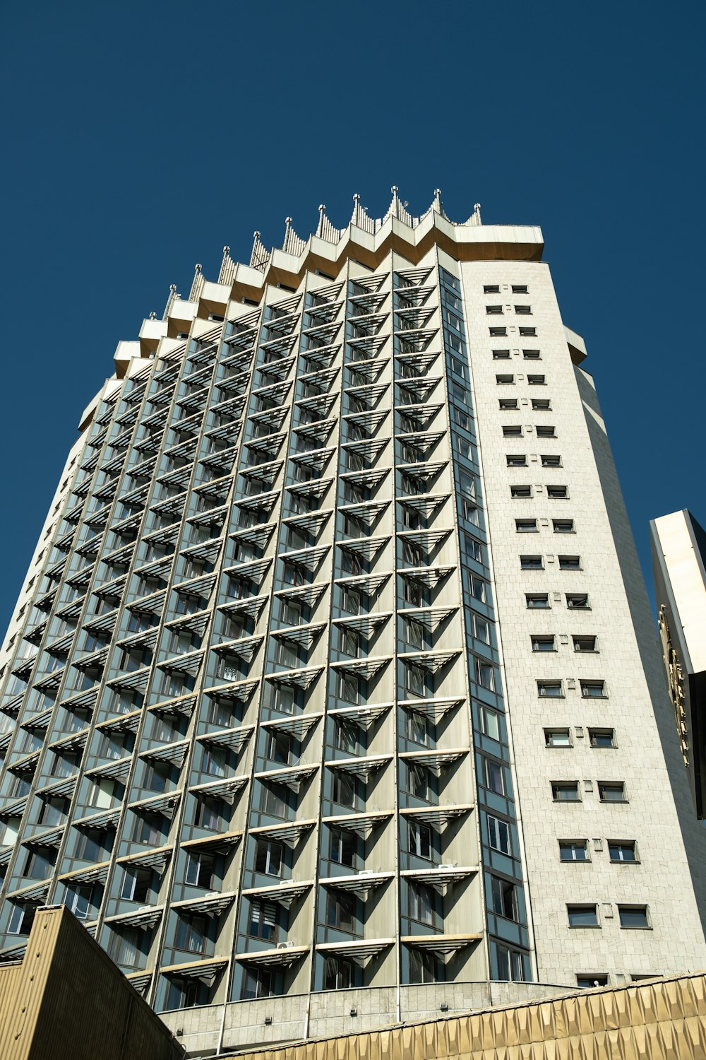 a very tall building with many windows on top of it