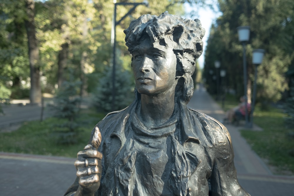 a statue of a woman with a flower in her hair