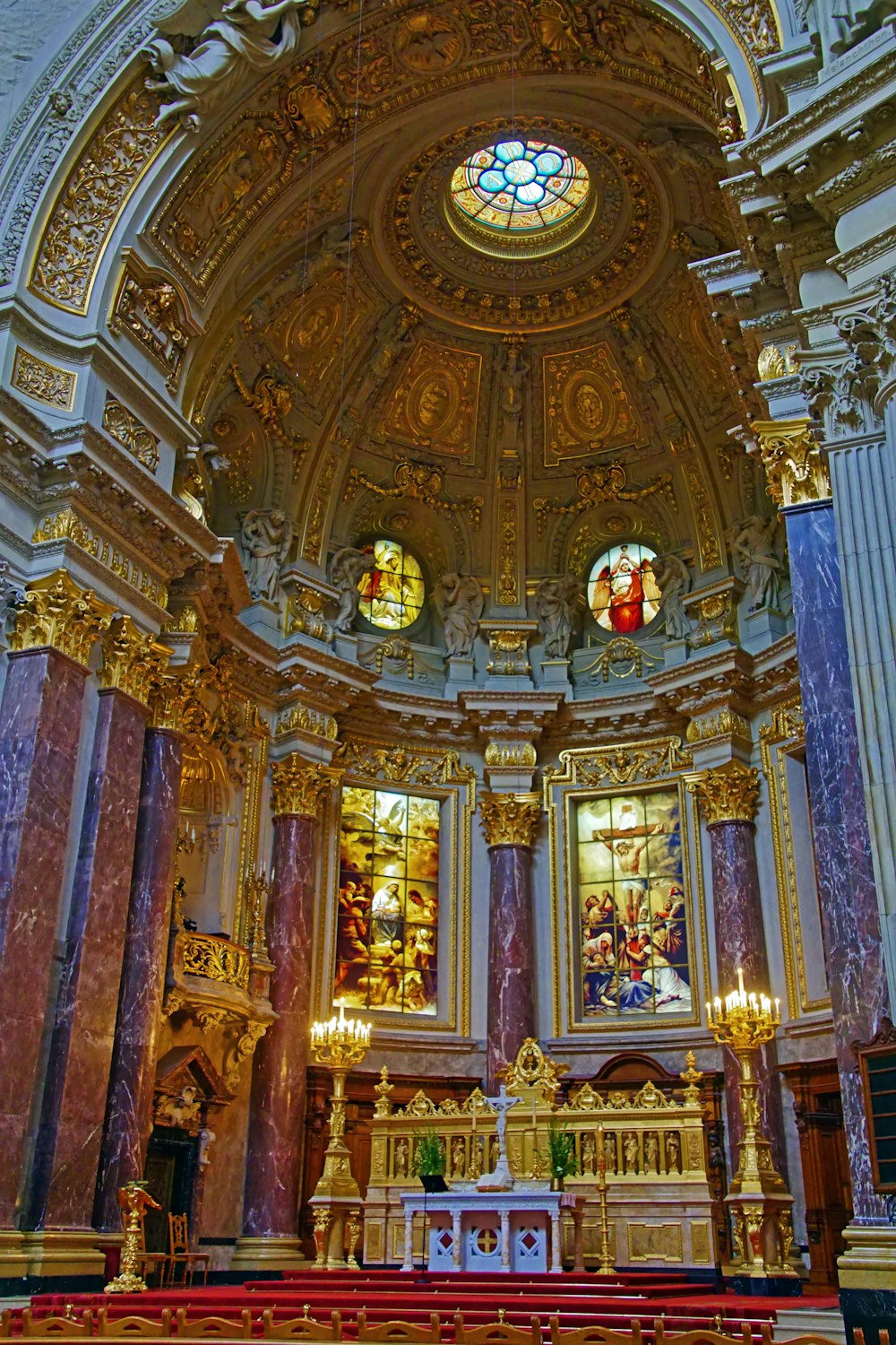 the interior of a church with a stained glass window