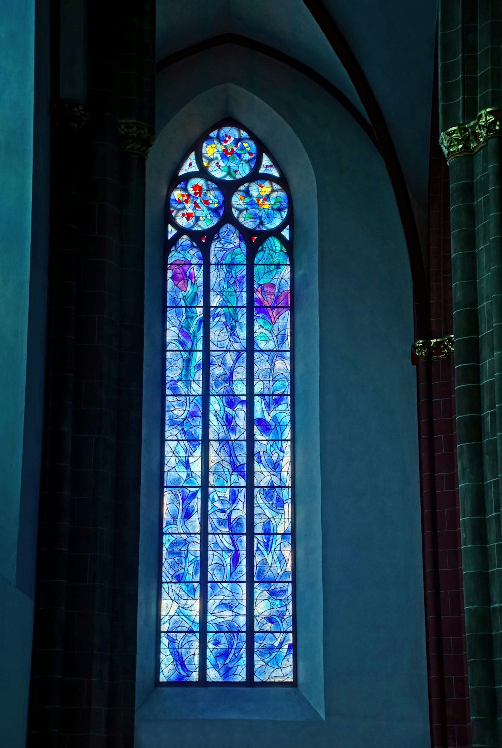 a stained glass window inside of a church