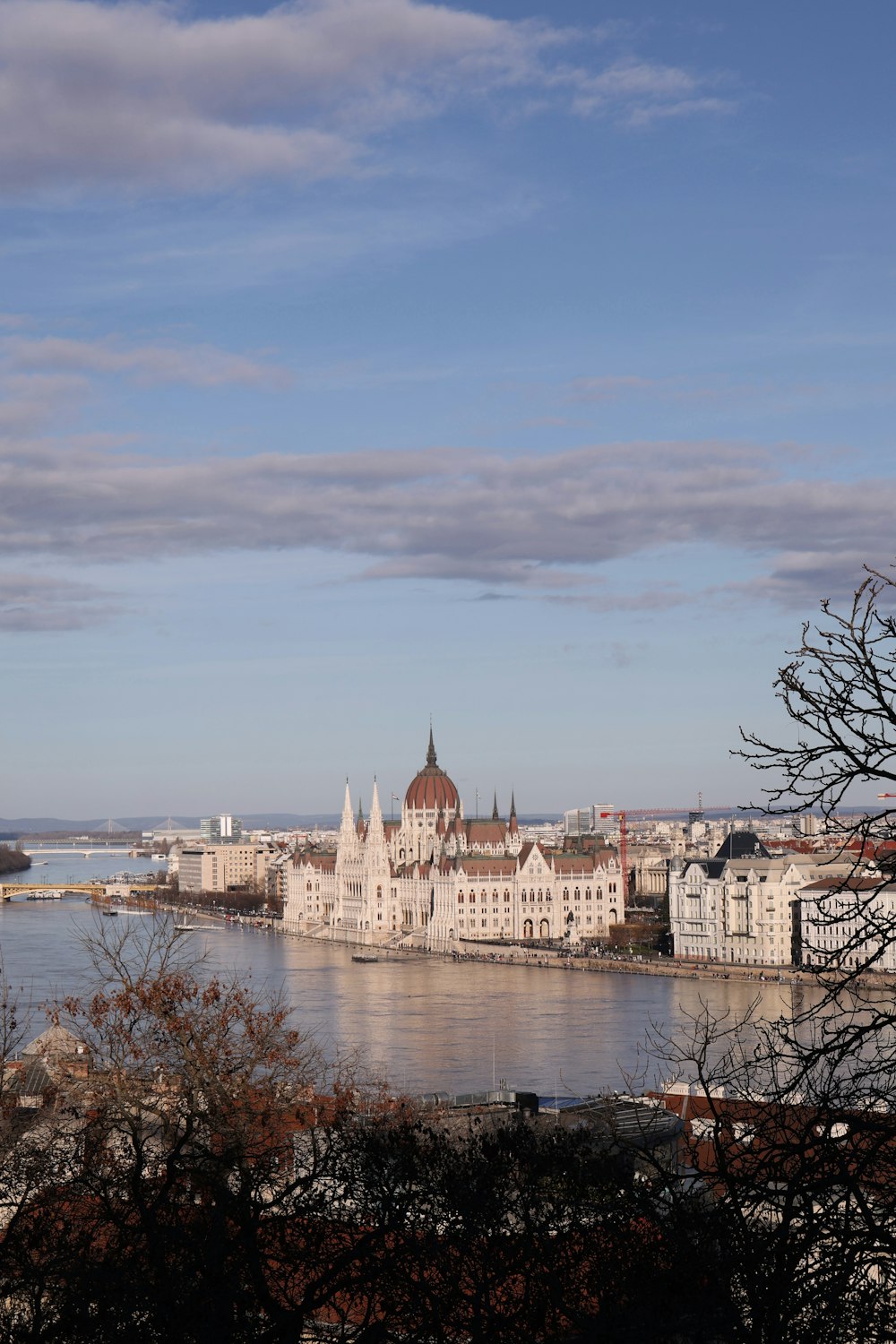 a large body of water with a large building in the background