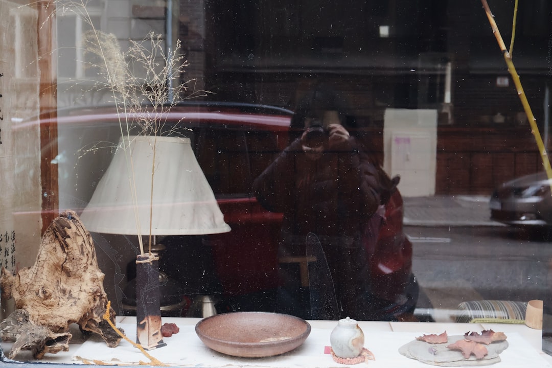 a person taking a picture of a window display,