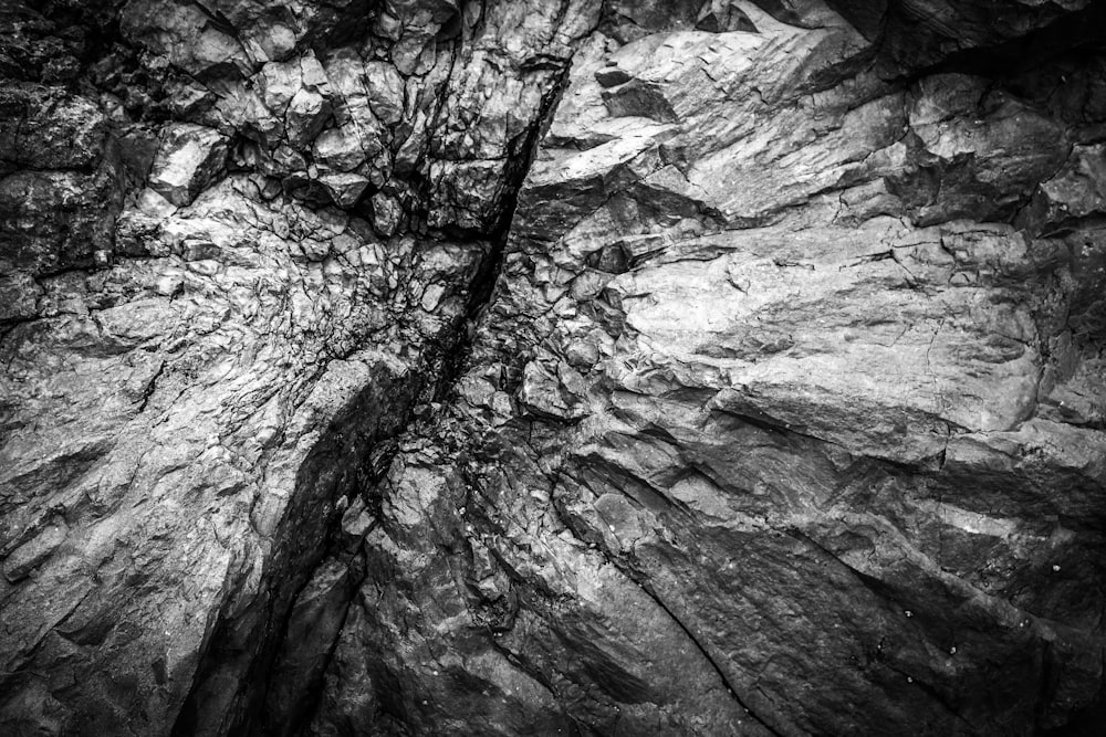 a black and white photo of a rock formation