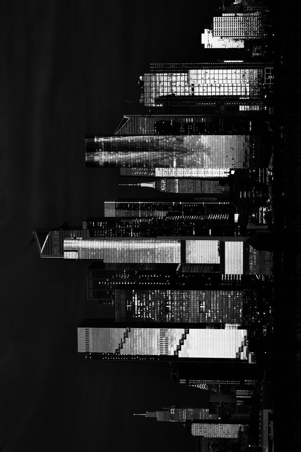 a black and white photo of a city at night