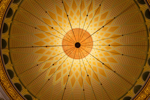 a ceiling in a building with a circular design