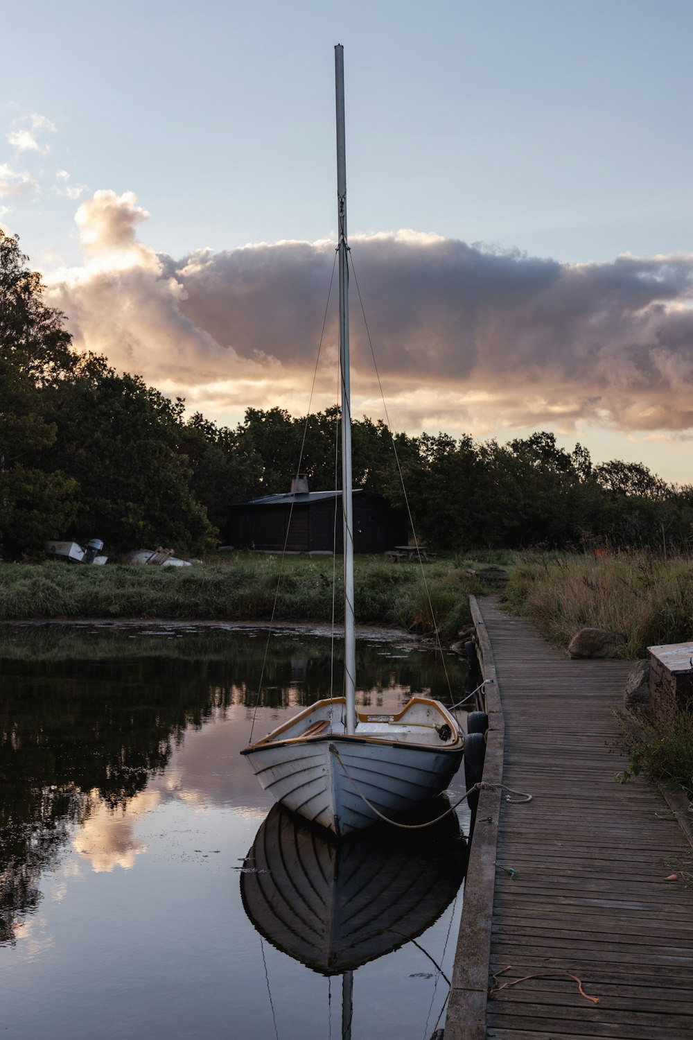 a small boat sitting on top of a body of water