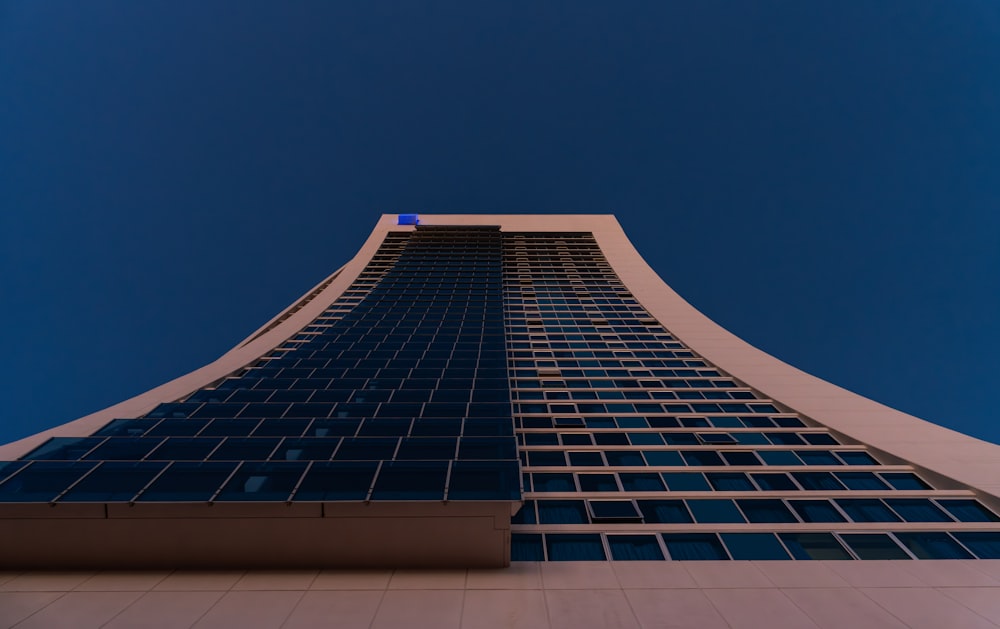 a tall building with a blue sky in the background