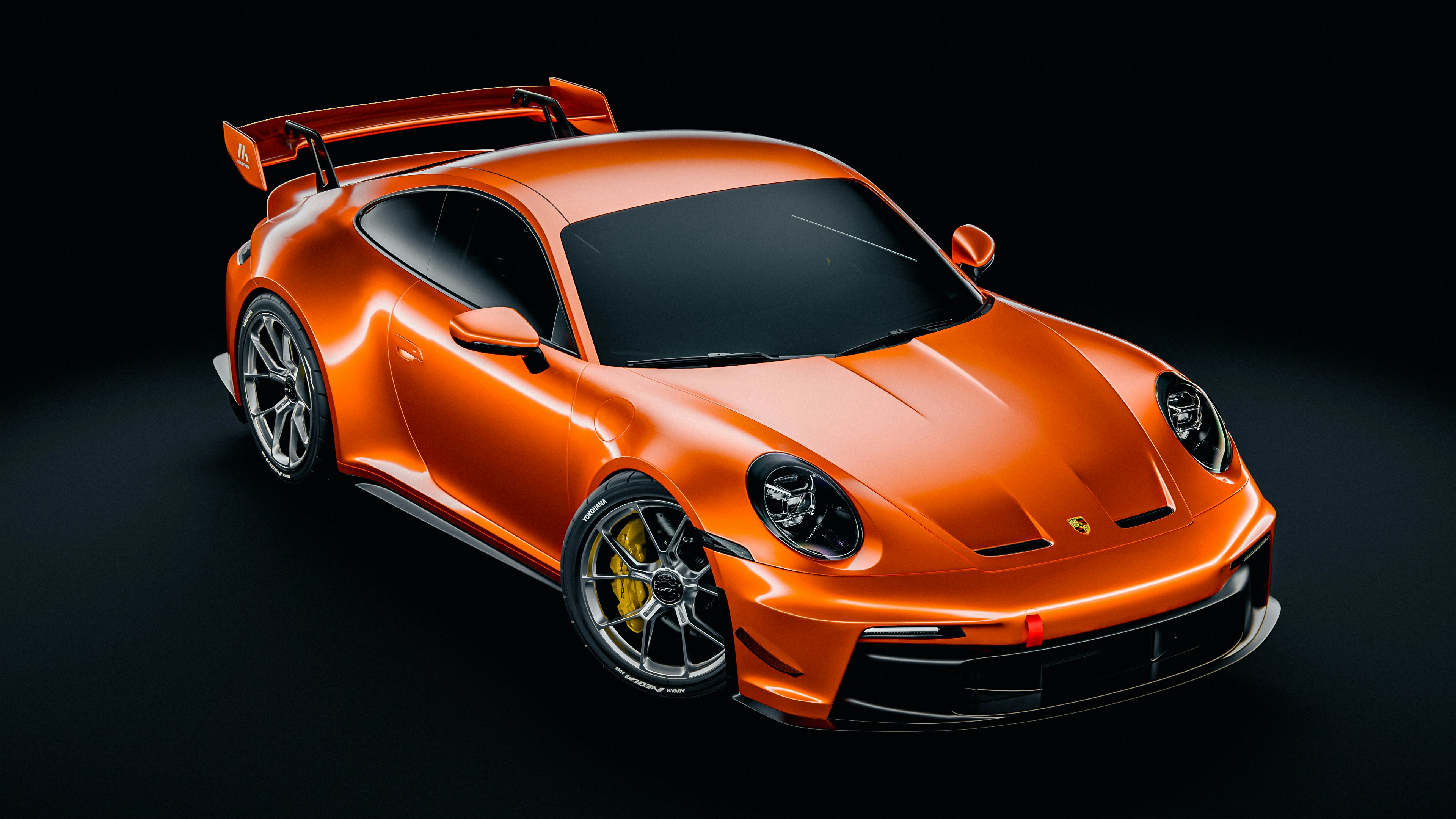 オレンジ色のスポーツカーが上から写っていますの写真 – Unsplashの