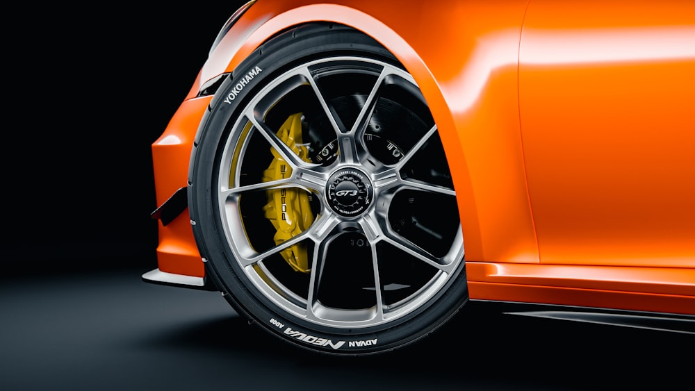 a close up of a wheel on a sports car