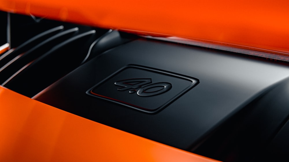 a close up of the hood of a sports car