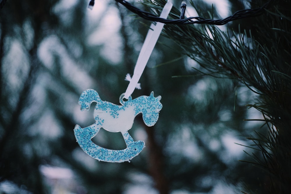 a christmas ornament hanging from a tree