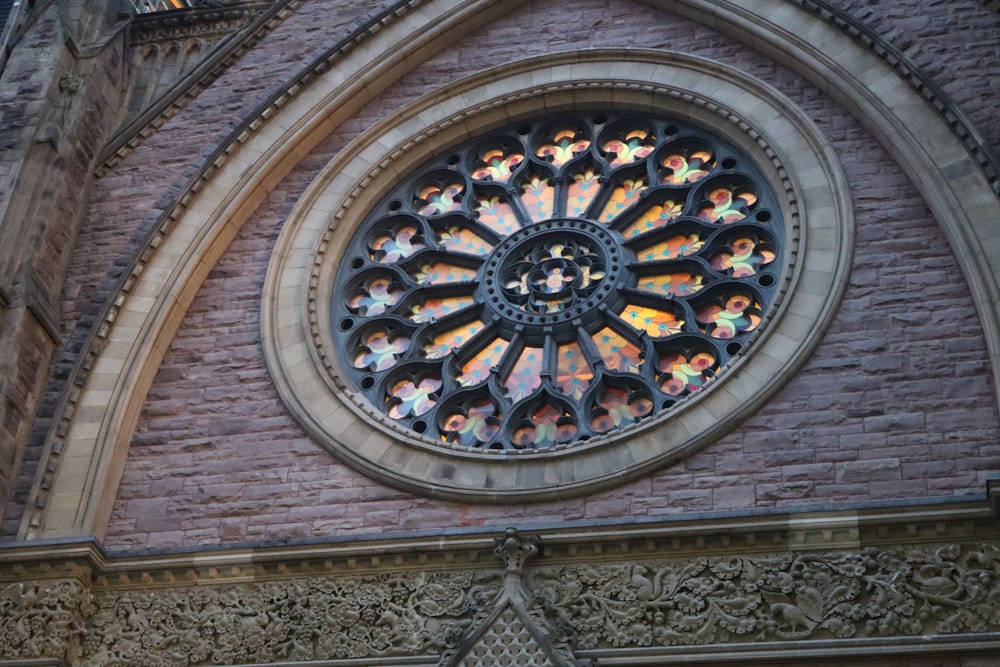 a large stained glass window on the side of a building