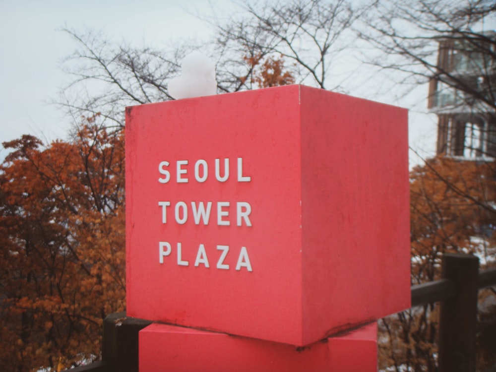 a red box with the words seoul tower plaza written on it