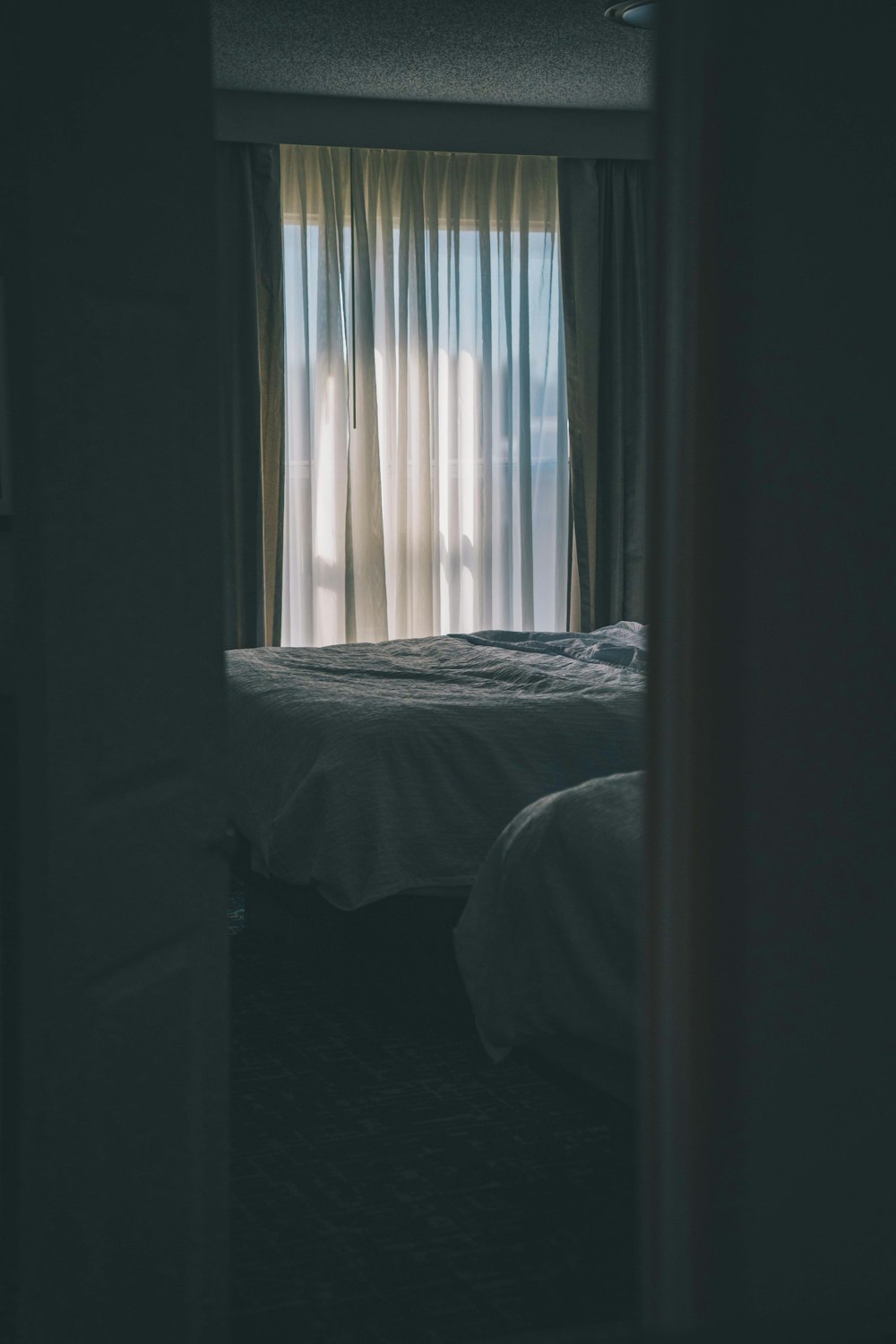 a view of a bedroom through a door