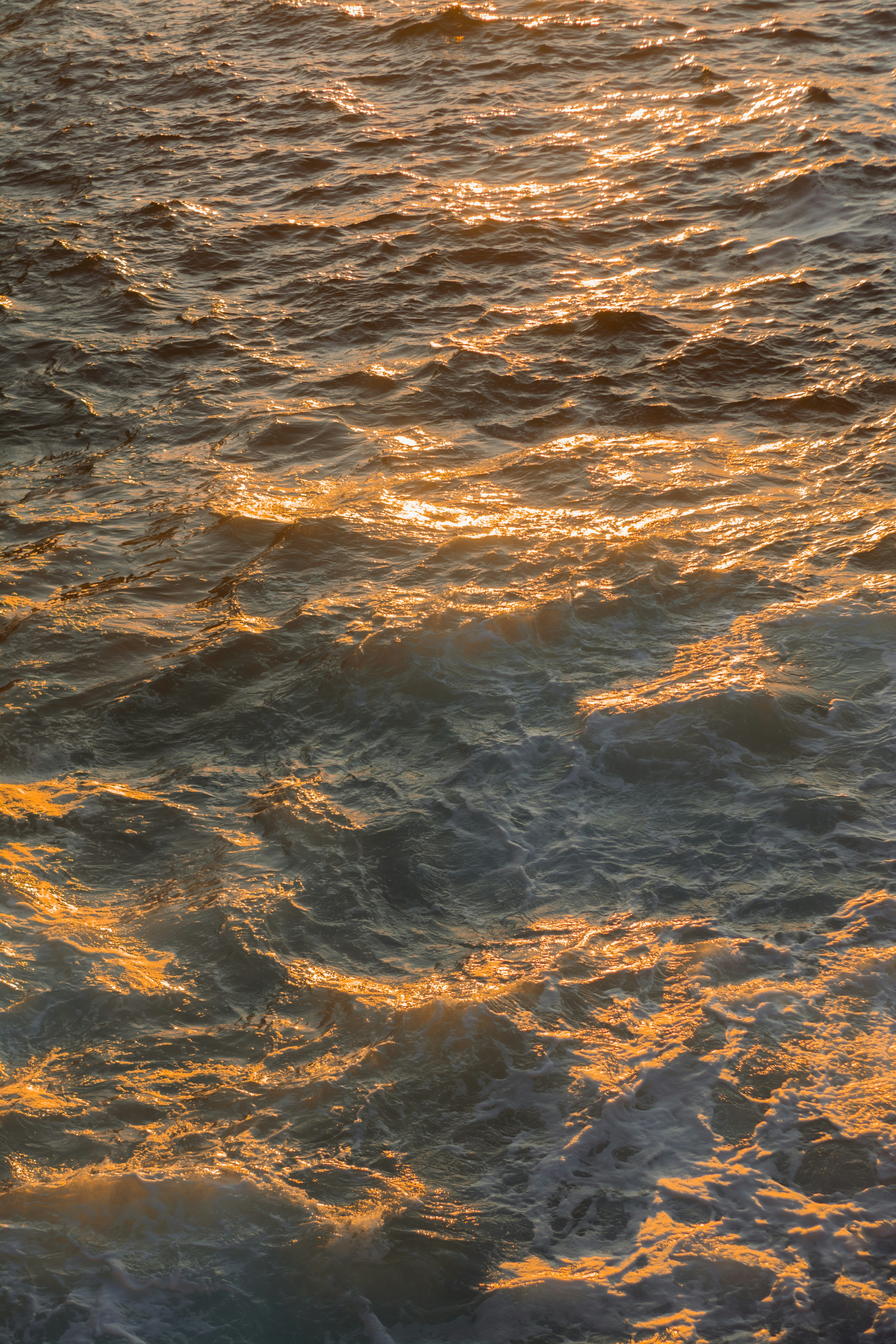 a person riding a surf board on a body of water