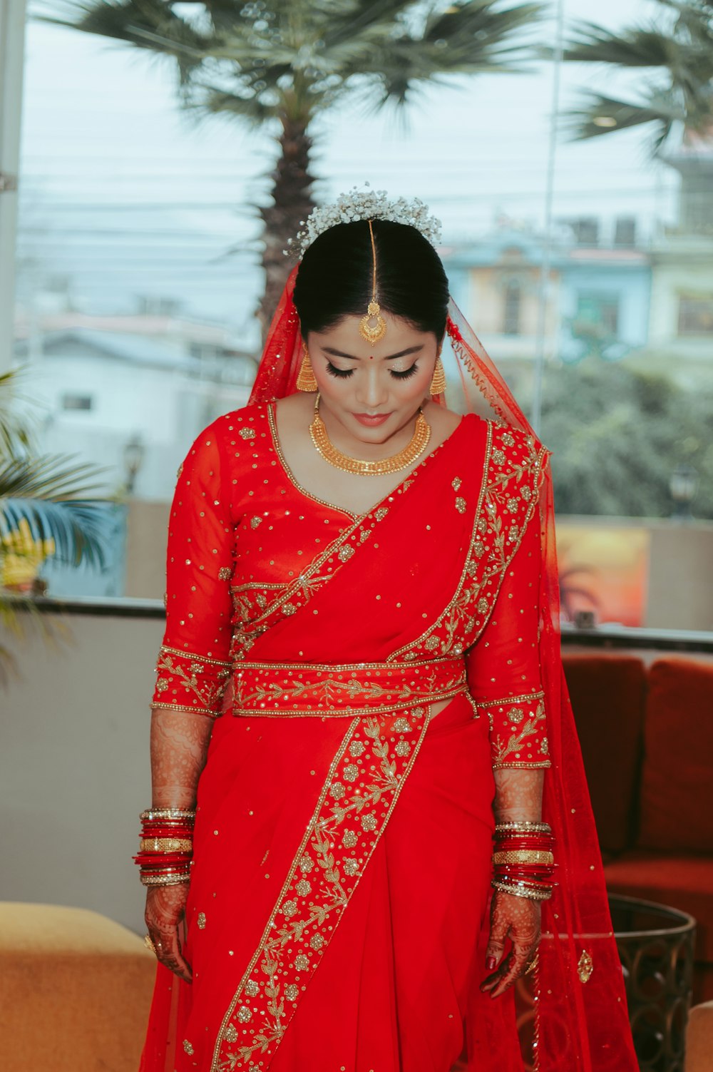 a woman in a red bridal gown