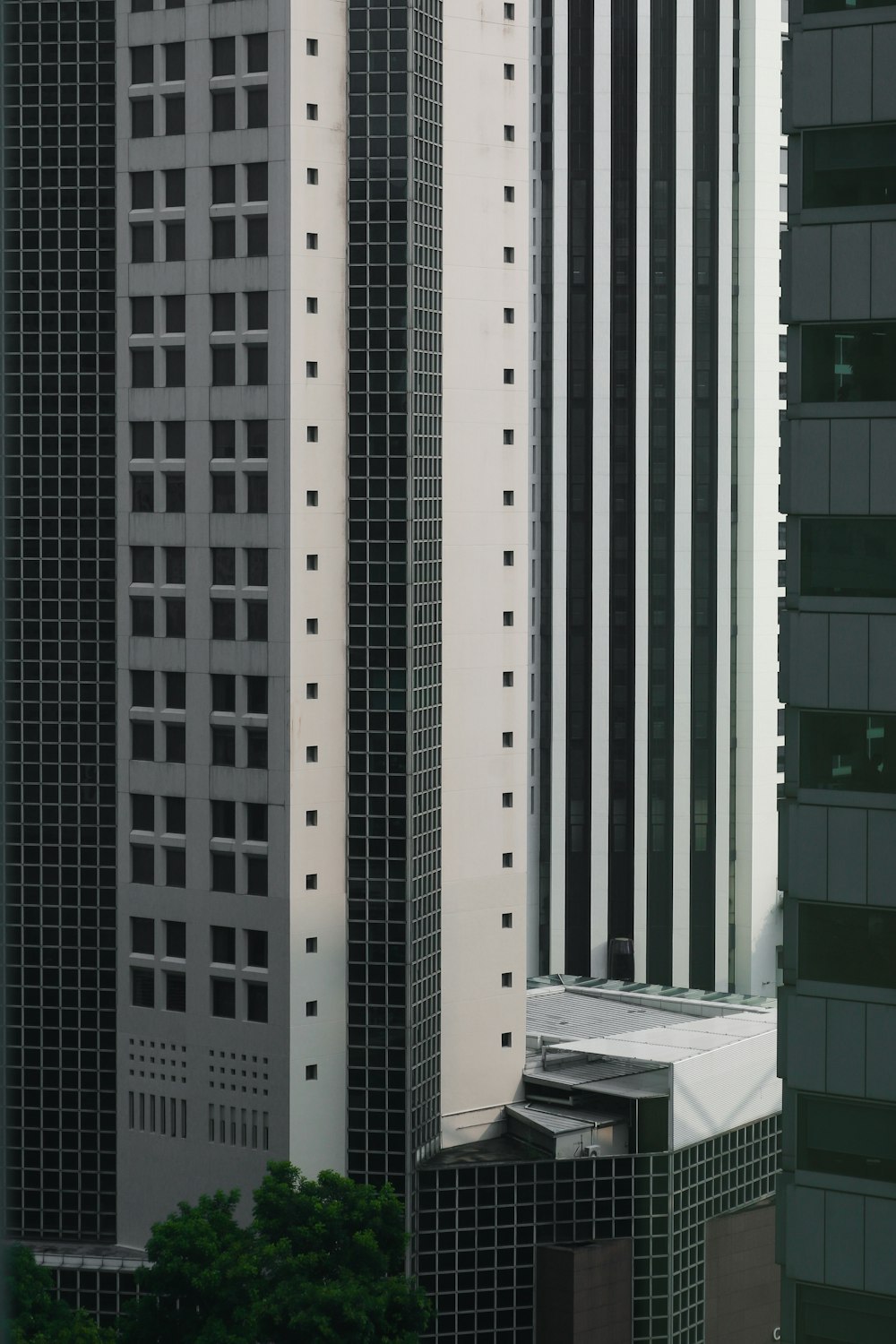 a very tall building next to other tall buildings