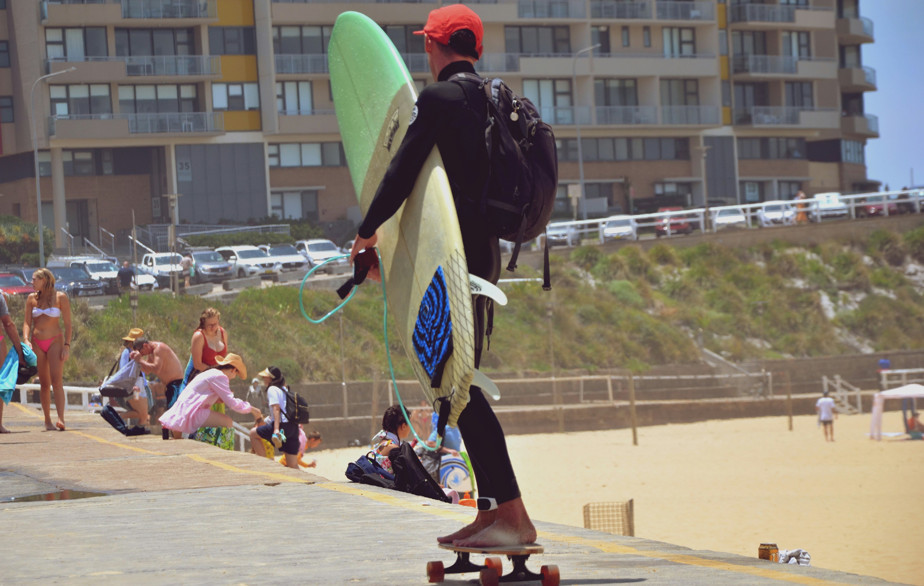 a man on a skateboard with a surfboard attached to his back