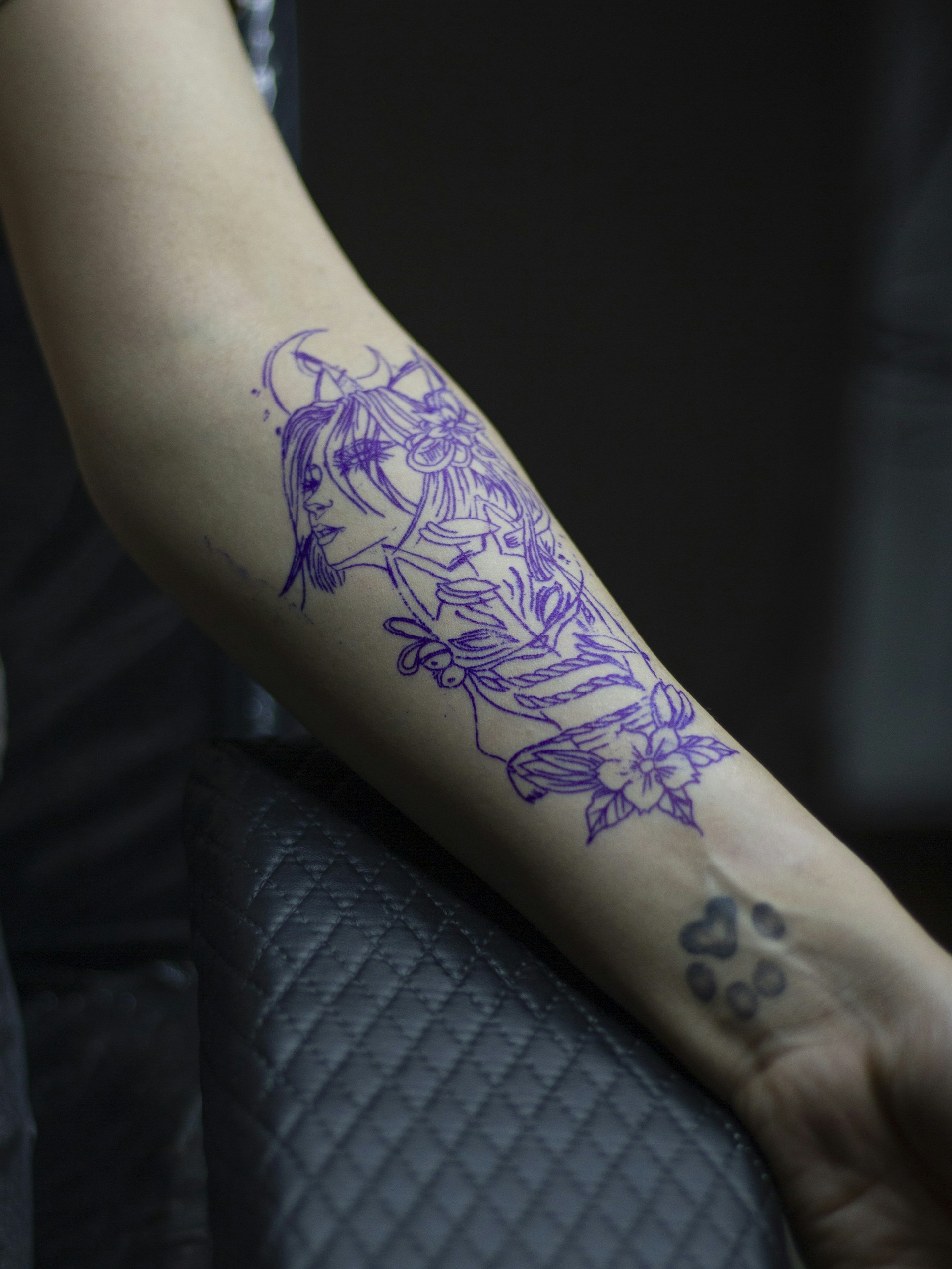a person with a tattoo on their arm