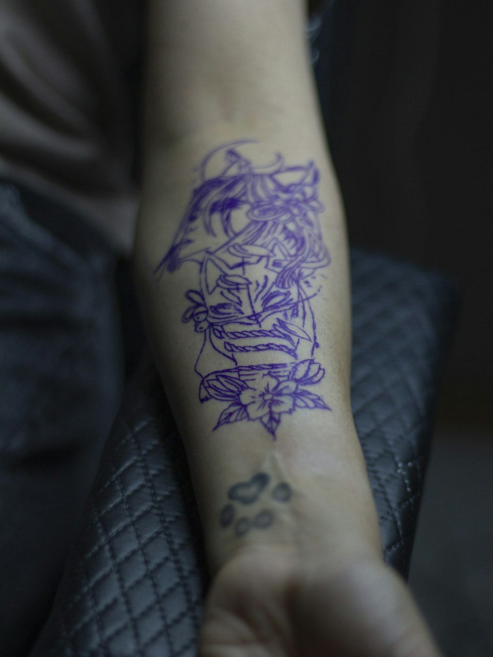 a person with a tattoo on their arm
