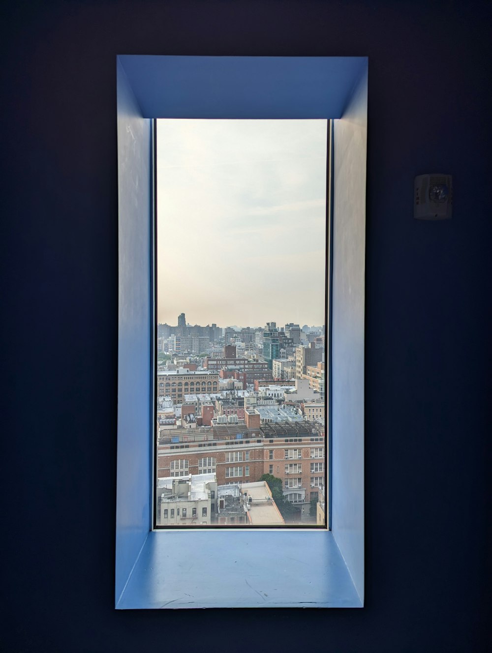 a window with a view of a city