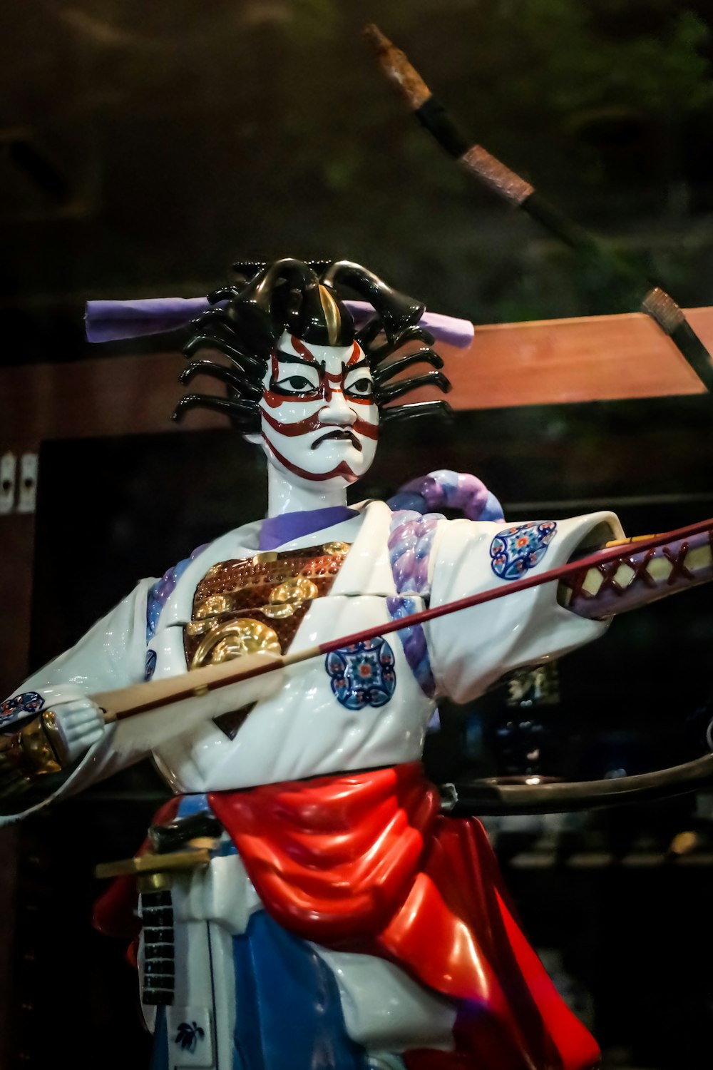 a statue of a samurai holding a sword