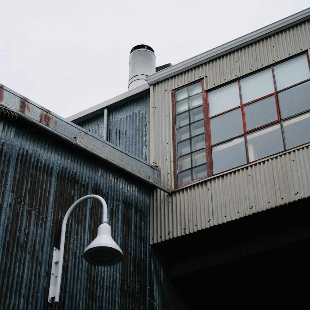 a street light next to a tall building