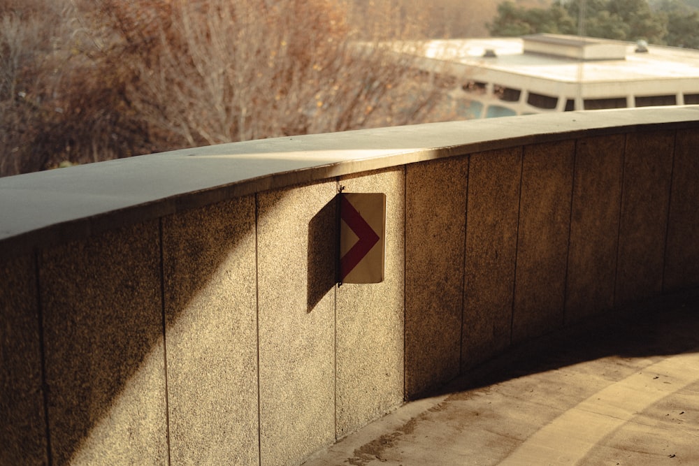 a sign on the side of a concrete wall