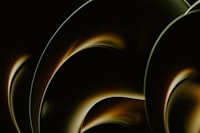 a close up of a black and gold background