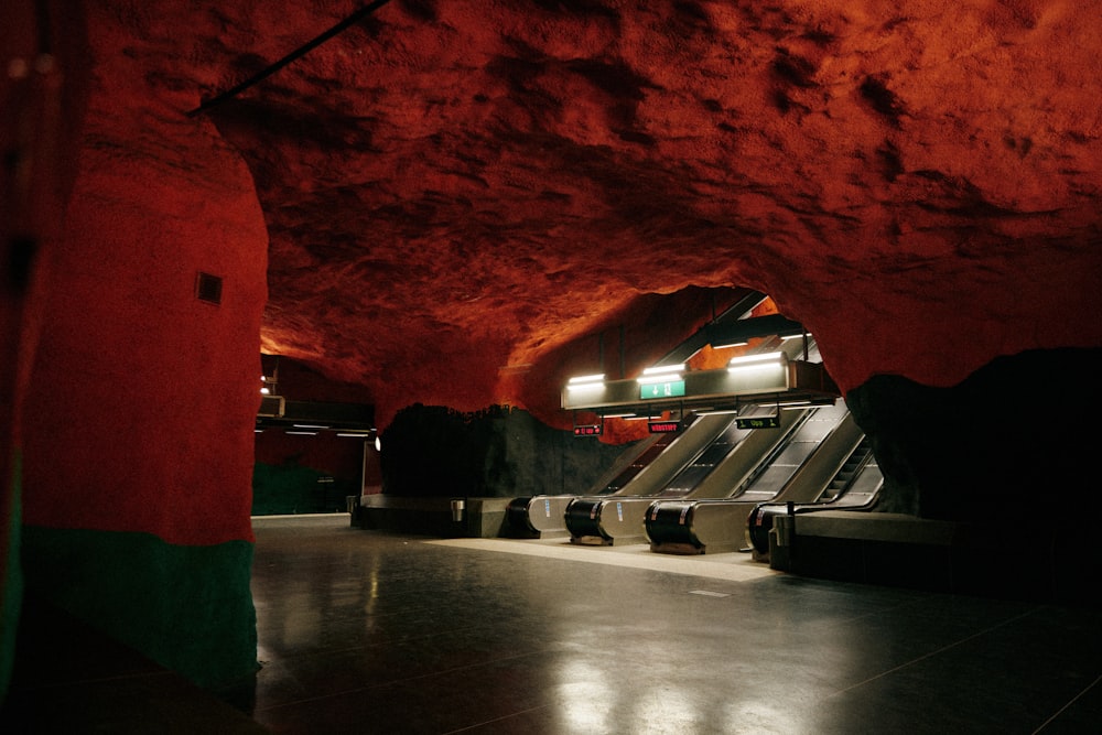 an underground subway station with escalators and stairs