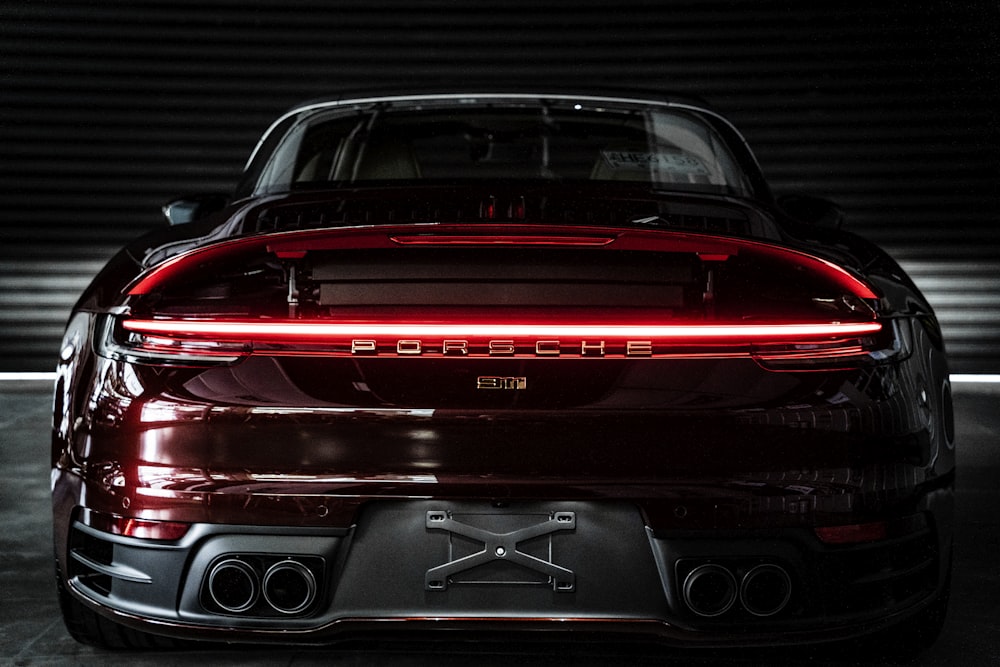 the back end of a red porsche car