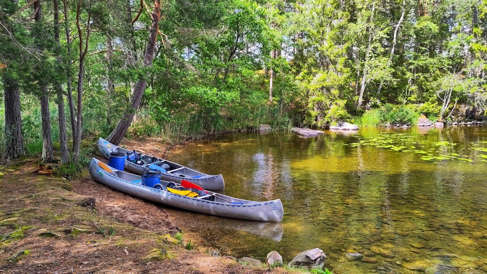 a couple of canoes that are sitting in the water