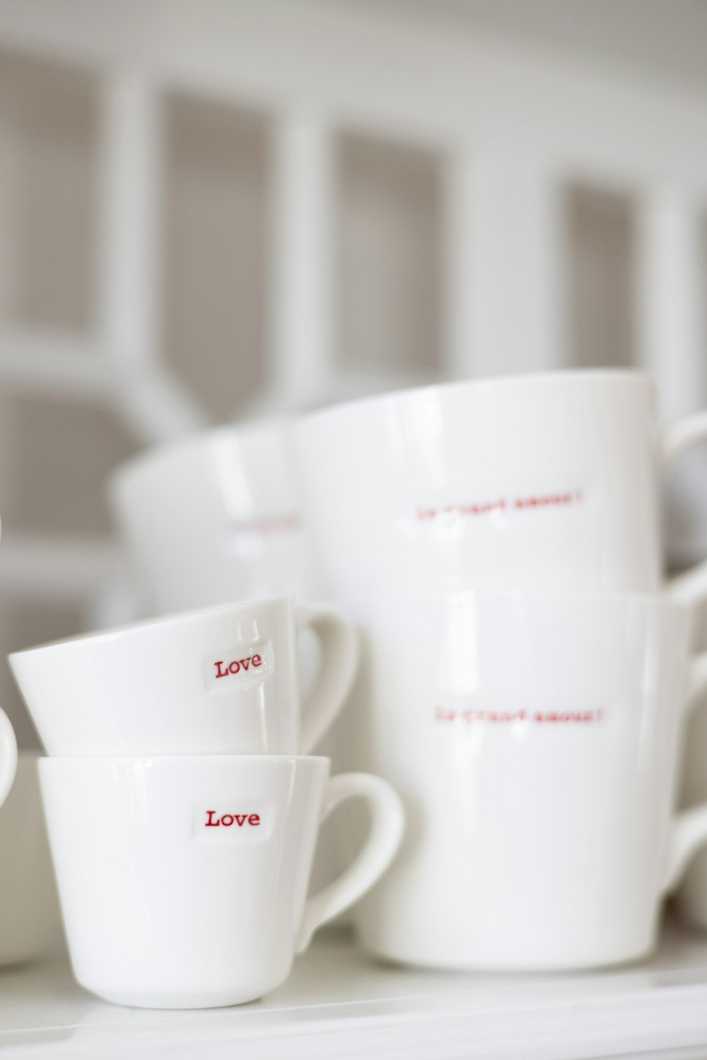 a close up of a stack of cups on a shelf