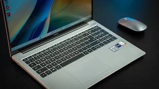 A Windows laptop computer sitting on top of a desk.