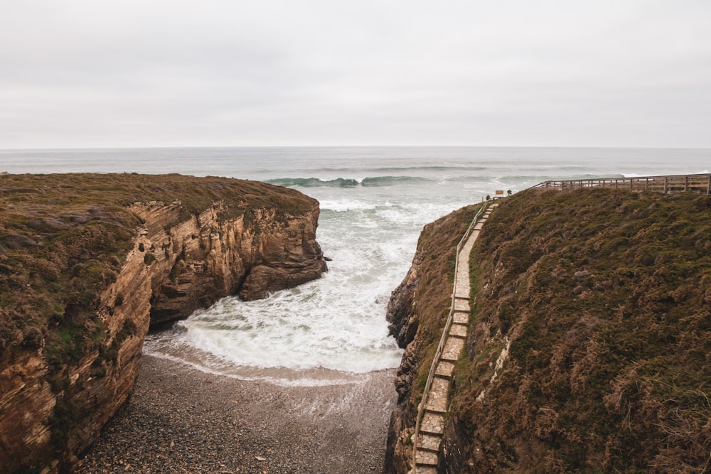 a view of the ocean from the top of a cliff