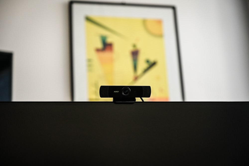 a black video camera sitting on top of a table