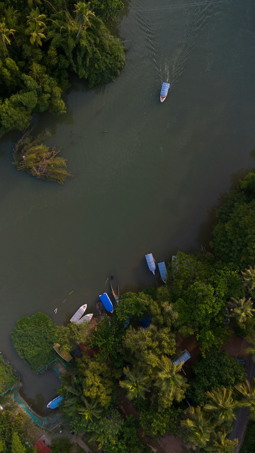an aerial view of a river with boats in it