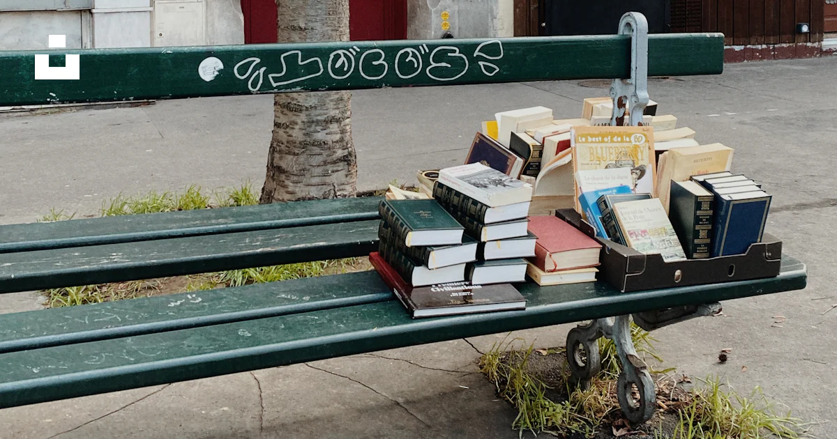 A bench with a bunch of books on top of it photo – Free Books Image on ...