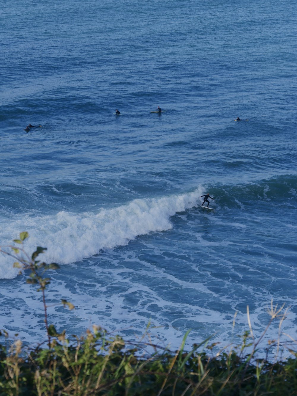 a person riding a surfboard on a wave in the ocean