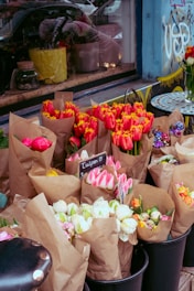 a bunch of flowers that are in some buckets