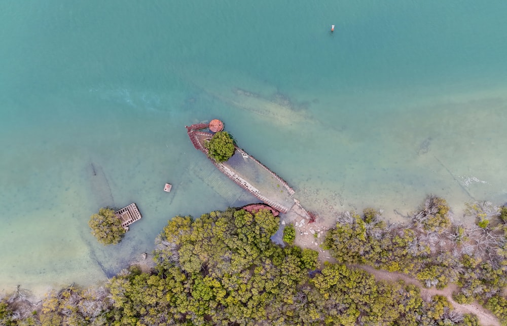 an aerial view of a dock in the water