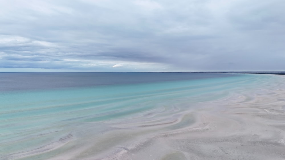 a view of the ocean from the top of a hill