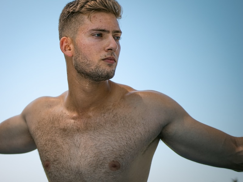 Sporty topless confident gay man