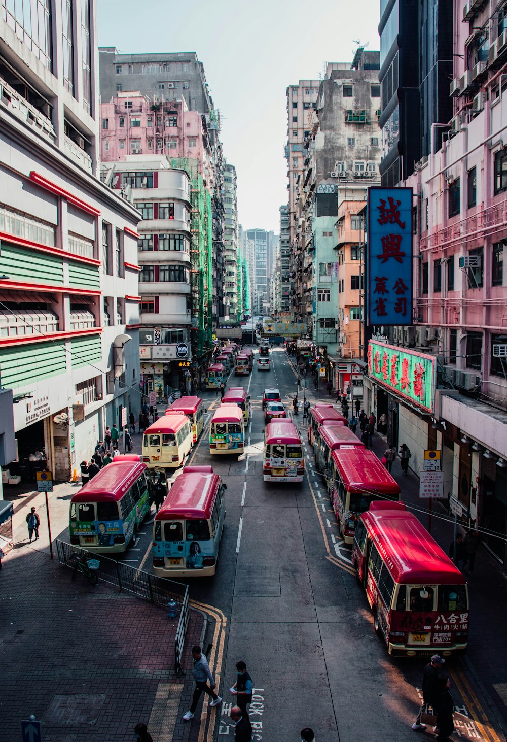 a city street filled with lots of buses